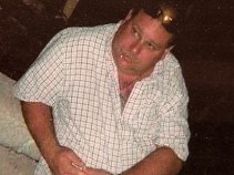 Former Cop Charged With Murder Surrenders