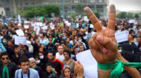 Defiant Iranians Clash With Riot Cops