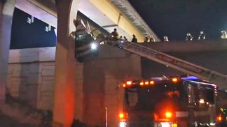 RAW VIDEO: Firefighters Pull Driver From Dangling Truck