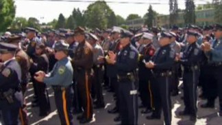 Thousands Say Goodbye to Officer Fox