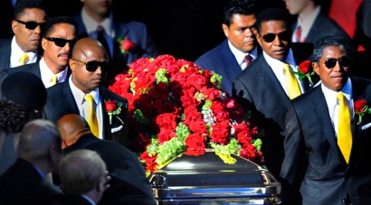 The King of Pop's gold-plated casket was covered in red roses and featured center stage -- but its whereabouts and details of his burial remain a mystery. 