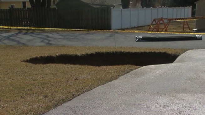 Officials are investigating the cause of a sinkhole that opened up behind a home in Northampton County, forcing a family to evacuate. NBC10's Claudia Rivero has the story.