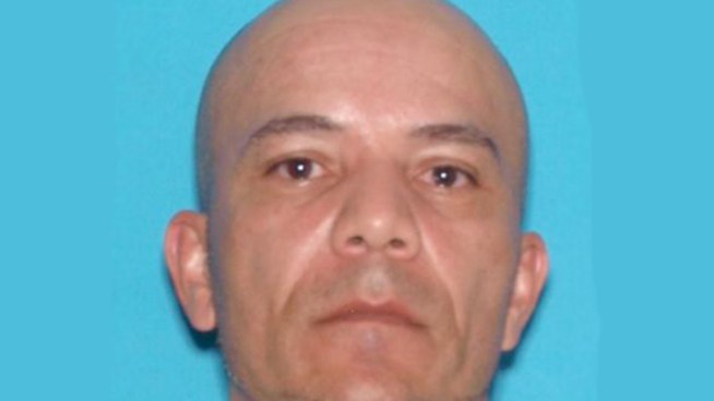 A man accused of stabbing his ex-girlfriend with a machete is in the hospital after he was shot by police.