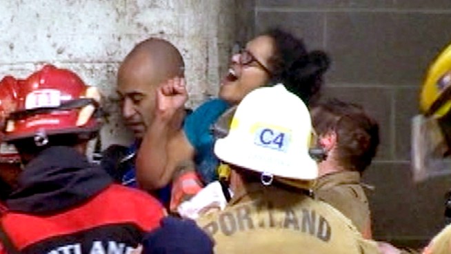 Portland Fire Bureau firefighters rescued a woman four hours after she somehow got wedged between two buildings during her smoke break. KGW TV's Art Edwards reports.