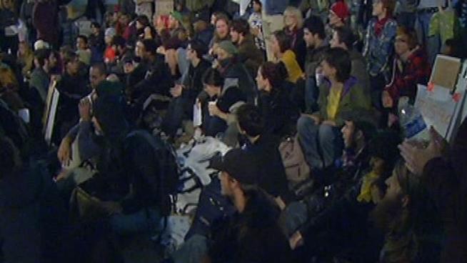 Dozens of Occupy Philly protesters stay at Dilworth Plaza downtown after eviction deadline expires.