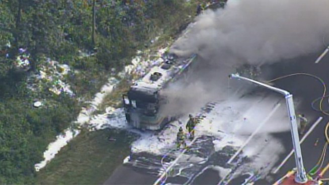 Crews dousing a burning bus, RV and tractor-trailer on the New Jersey Turnpike on Tuesday, June 28, 2011. Mansfield, Burlington County.