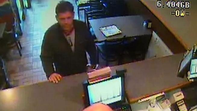 Surveillance video shows what police say is a disgruntled pizza shop owner trying to sabotage his competition by unleashing bags of live mice in their restaurants.