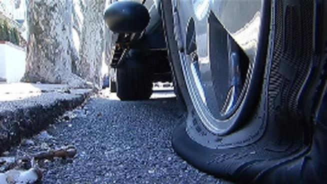 Police are searching for the suspect who has been slashing tires on a Mayfair street over the last several months.