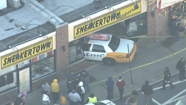 A taxi cab crashes into a sneaker store in Roxborough.  One person is hurt.