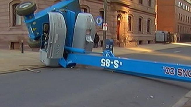 A cherry picker fell over outside of the Cathedral Basilica of Saints Peter and Paul at 18th and Race Streets says police. The worker suffered a broken femur. 