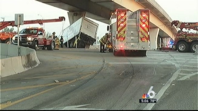 One person was killed and another hospitalized after the box truck they were in crashed and was left dangling off the side of a South Florida highway overpass early Wednesday. NBC 6 reporter Betty Yu has the latest details.