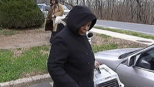 A woman shot and killed a man who police say, tired to rob her son in the stairwell of their apartment complex. 