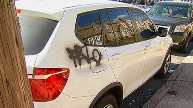 Police are searching for the vandals responsible spray-painting more than two dozen cars in Mayfair.