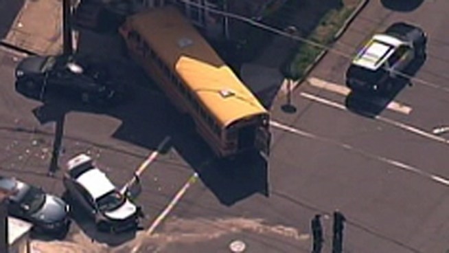 A school bus crashed in the 700 block of Division Street in Trenton, N.J. Friday afternoon. Nine Notre Dame High School students suffered minor injuries when police say, a car ran a stop sign and crashed into the bus. The bus then crashed into a parked car and a house. Police are searching for the driver of the car. NBC10's Claudia Rivero reports.