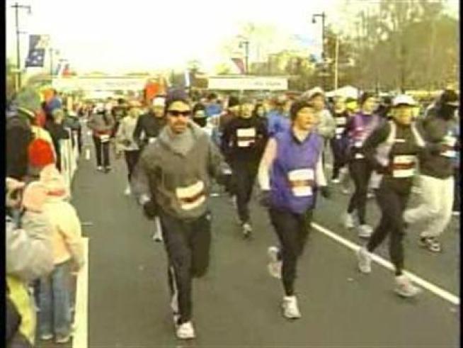 Runners set off for the 15th annual Philadelphia Marathon on the Benjamin Franklin Parkway Sunday morning.