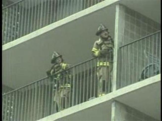 Dozens of residents are forced out into the rain when fire breaks out in their <a title=