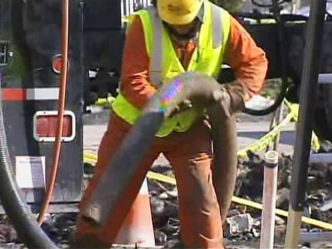 Officials spent the day removing a cracked portion of a gas line believed to be the cause behind last Wednesday's blast that killed five people and leveled several row homes.