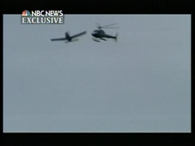 Witness the moment of impact between a small plane and sightseeing helicopter over the <a title=
