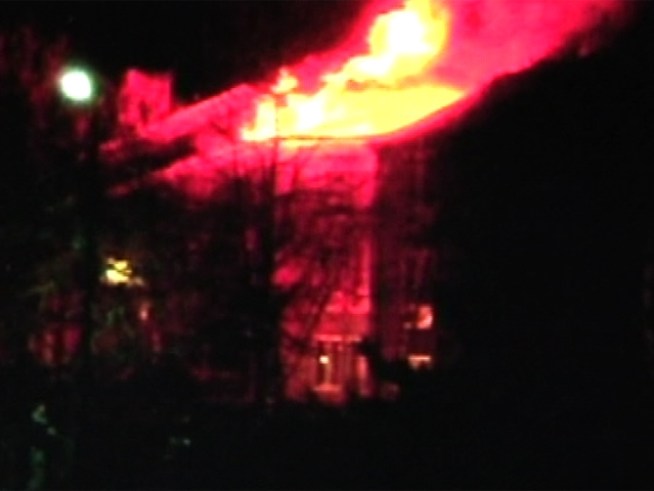 Two dozen apartments destroyed after fire cuts through a <a title=