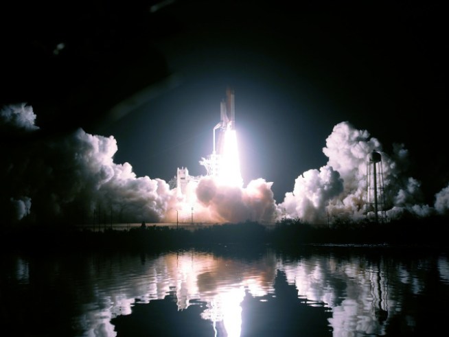 Shuttle Discovery Docks at Space Station