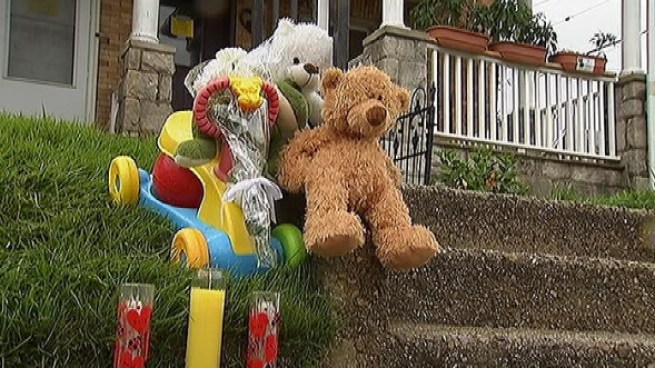 Neighbors mourned the mother and son who died this morning in a row-home fire in Coatesville, Pa.