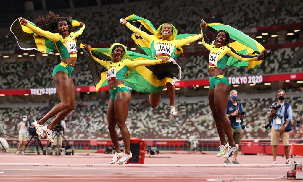Briana Williams, Elaine Thompson-Herah, Shelly-Ann Fraser-Pryce and Shericka Jackson of Team Jamaica celebrate winning the gold medal in the Women's 4 x 100m Relay Final on day fourteen of the Tokyo 2020 Olympic Games at Olympic Stadium on Aug. 6, 2021 in Tokyo, Japan. 