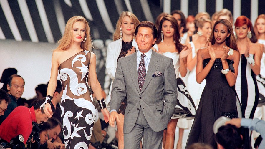 Italian fashion designer Valentino Garavani walks the catwalk with his models after a fashion show on October 20, 1991 in Paris, France. 