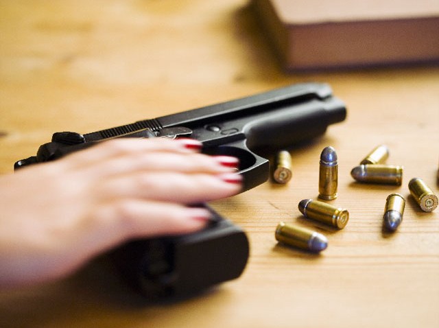 091510 woman gun handgun pistol generic