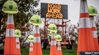 road cones with helmets on top of them