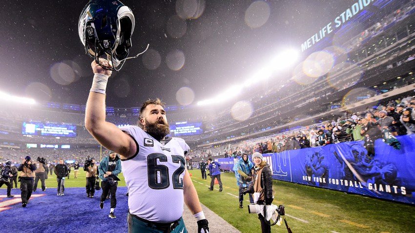 Jason Kelce raises his helmet