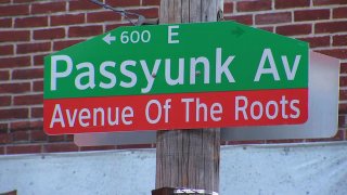 Street sign reading Avenue of The Roots