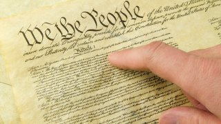 The Bill of Rights and a finger pointing to "We The People"