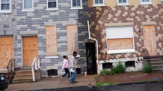 Boarded up homes on a street