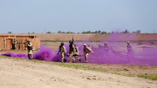 Iraqi soldiers take part in a military exercise at Camp Taji, north of Baghdad, Iraq, Monday, March 20, 2017.