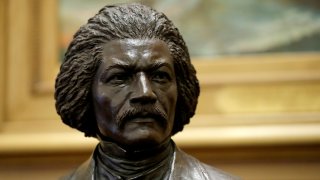 A bronze statue of abolitionist Frederick Douglass is seen during a private viewing ahead of its unveiling at the Maryland State House, Monday, Feb. 10, 2020, in Annapolis. The statue, along with a statue of Harriet Tubman, will be unveiled Monday night in the Old House Chamber, the room where slavery was abolished in Maryland in 1864.