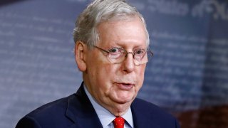 Senate Majority Leader Mitch McConnell of Ky., speaks with reporters after the Senate approved a nearly $500 billion coronavirus aid bill, Tuesday, April 21, 2020, on Capitol Hill in Washington.