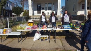 Outdoor volunteer food pantry