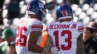 In this Nov. 25, 2018, file photo, Saquon Barkley #26 of the New York Giants talks to Odell Beckham Jr. #13 prior to the game against the Philadelphia Eagles at Lincoln Financial Field in Philadelphia, Pennsylvania.