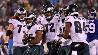 Boston Scott #35 of the Philadelphia Eagles celebrates with his teammates after scoring a touchdown against the New York Giants during the third quarter in the game at MetLife Stadium on December 29, 2019 in East Rutherford, New Jersey.