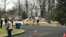 First responders outside a destoryed home