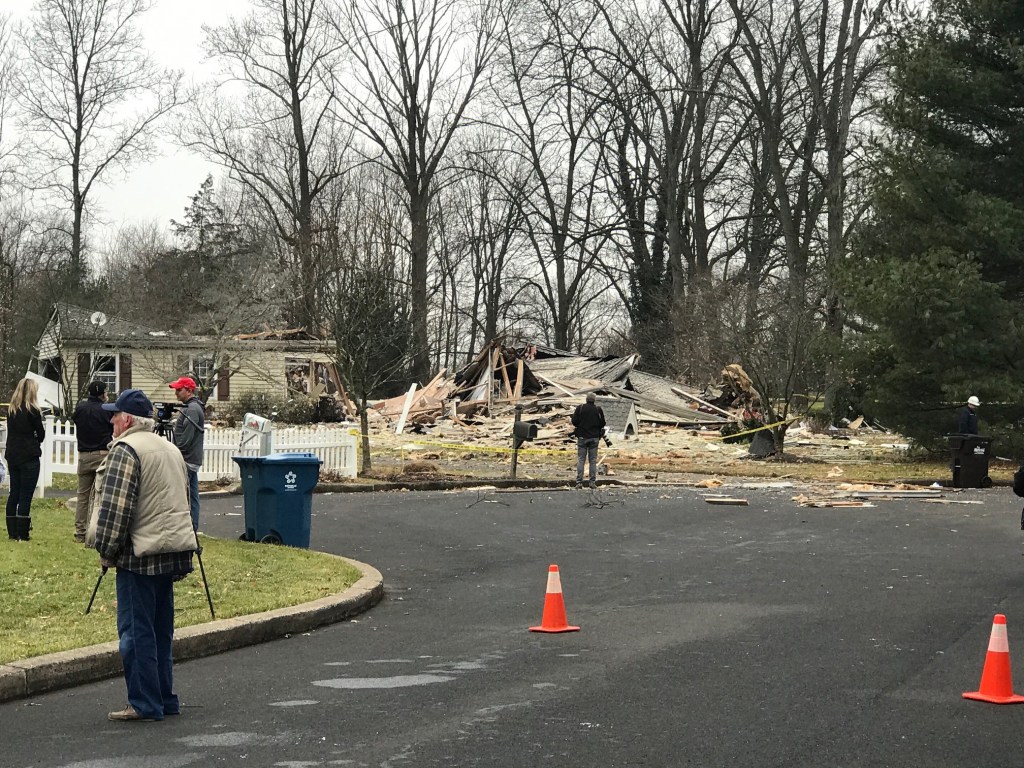 First responders outside a destoryed home