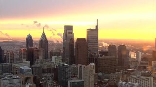The sun rises of the Philadelphia skyline.