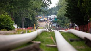 Sections of steel pipe lie in a staging area before being inserted underground as part of the ETP-Sunoco Mariner East 2 pipeline in the Marchwood neighborhood of Exton, Pennsylvania on June 5, 2019