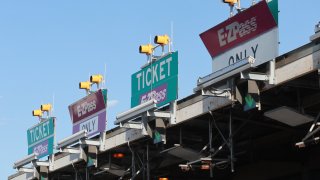 E-Z Pass lanes are marked at a toll plaza on the New Jersey Turnpike