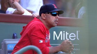 In this Sept. 28, 2019, file photo, Alex Cora watches the game with the Boston Red Sox down 8-3 in the sixth inning.
