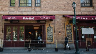 A restaurant serves take-out meals through their window in Philadelphia, Pennsylvania, U.S., on Wednesday, April 15, 2020.