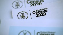 In this March 19, 2020, file photo, the U.S. Census logo appears on census materials received in the mail with an invitation to fill out census information online in San Anselmo, California.
