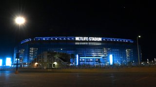 Metlife Stadium is illuminated in blue to honor essential workers on April 09, 2020 in East Rutherford, New Jersey.