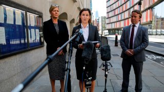 Metropolitan police press officer Melanie Pressley (C) gives a statement outside the Old Bailey on behalf of the family of the victim, in London on June 26, 2020, after a troubled British teenager who threw the six-year-old French boy off a viewing platform at London's Tate Modern art gallery last year was jailed for life. Judge Maura McGowan told Jonty Bravery, 18, he would spend at least 15 years in custody for attempting to murder the boy in front of horrified crowds on August 4 last year.