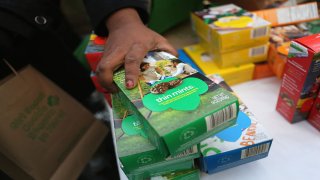 In this file photo, Girl Scouts sell cookies as a winter storm moves in on February 8, 2013 in New York City. The scouts did brisk business, setting up shop in locations around Midtown Manhattan on National Girl Scout Cookie Day.